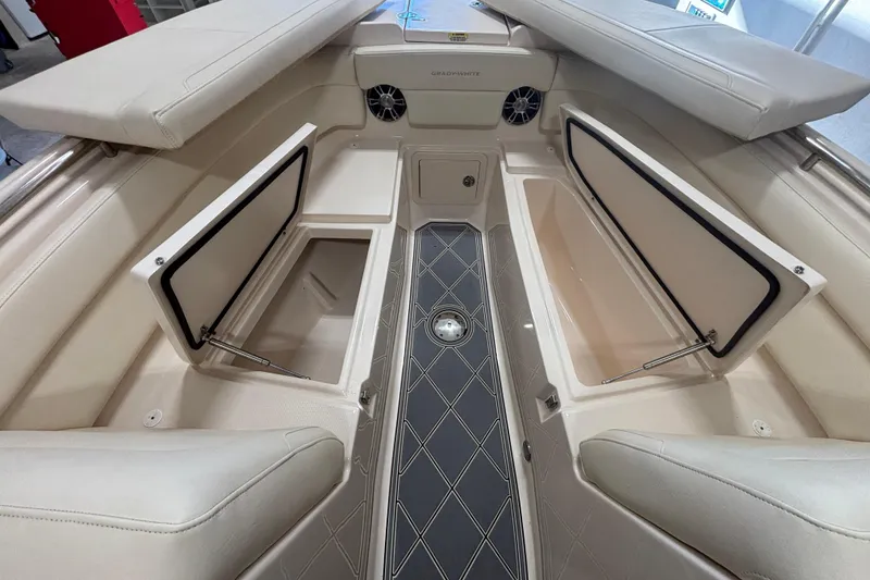 Slide: The Image of 2022 Grady-White Freedom 275 boat interior with open storage compartments. - 24