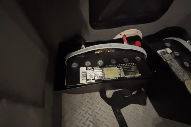 Slide: The Image of Battery compartment of 2022 Grady-White Freedom 275 boat, featuring AGM batteries. - 26