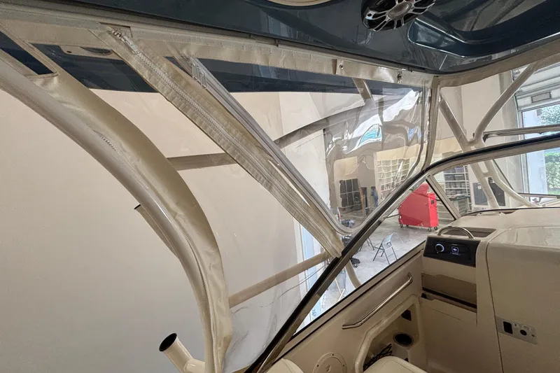 Slide: The Image of Interior view of 2022 Grady-White Freedom 275 boat, showcasing helm and seating area. - 30