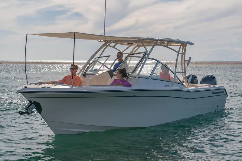 Slide: The Image of Manufacturer Provided Image: 2022 Grady-White Freedom 275 boat cruising on the water with passengers. - 6