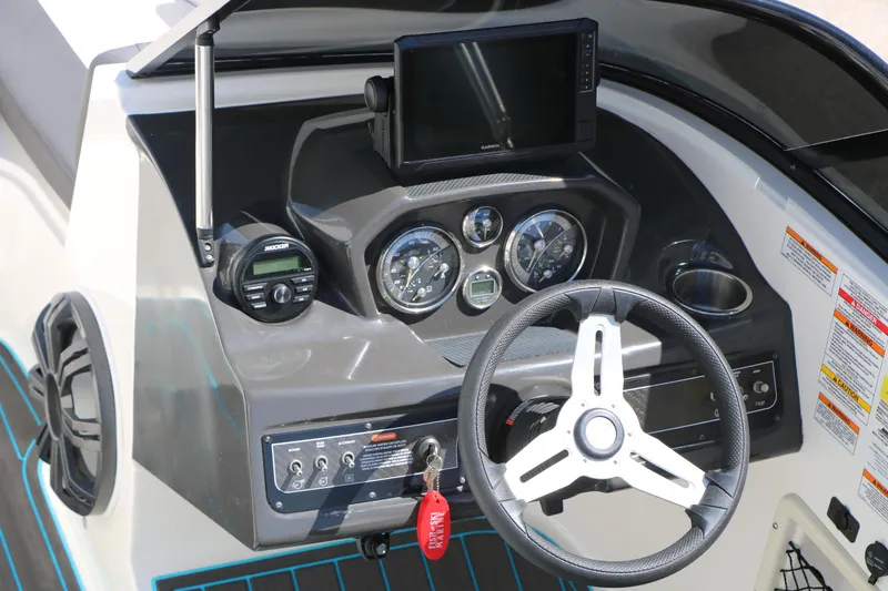 Slide: The Image of Dashboard of 2022 Bayliner VR5 Bowrider I/O with steering wheel and gauges. - 18