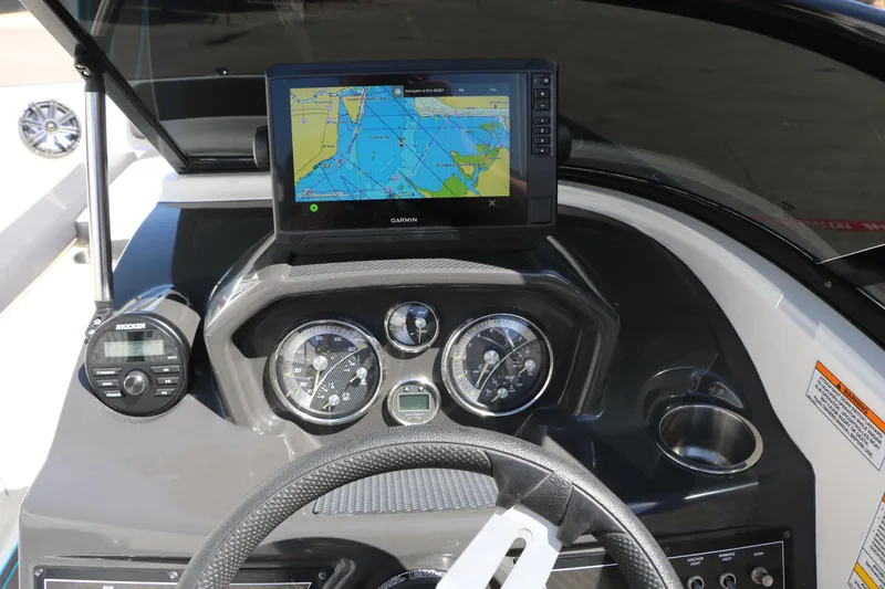 Slide: The Image of Dashboard of 2022 Bayliner VR5 Bowrider I/O with navigation system and controls. - 20