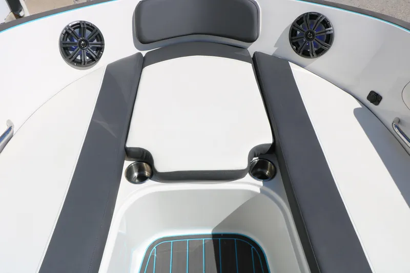 Slide: The Image of 2022 Bayliner VR5 Bowrider I/O boat interior with cushioned seating and speakers. - 22