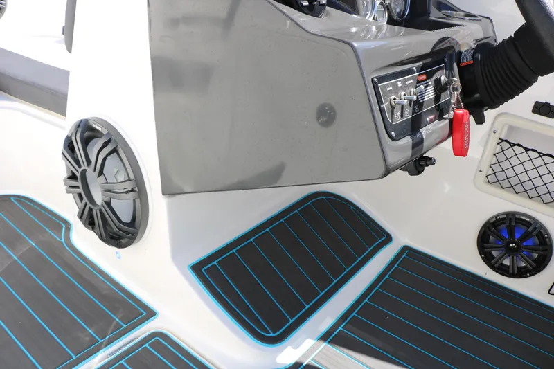 Slide: The Image of 2022 Bayliner VR5 Bowrider I/O dashboard with modern controls and speakers. - 25