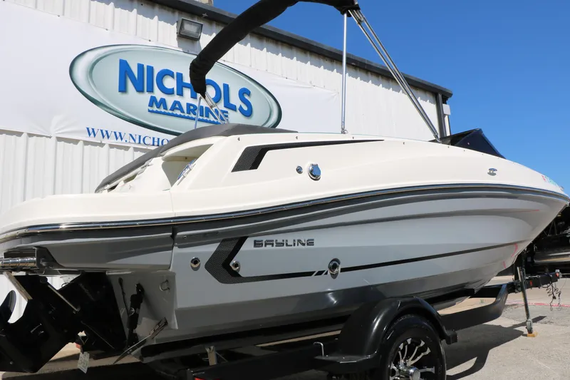 Slide: The Image of 2022 Bayliner VR5 Bowrider I/O boat displayed at Nichols Marine dealership. - 8