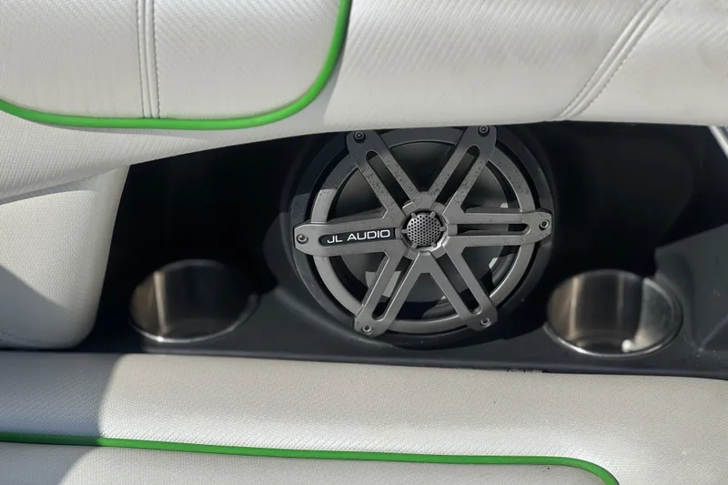 Slide: The Image of JL Audio speaker in 2013 MasterCraft XStar boat with stylish white and green interior. - 33