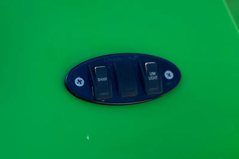 Slide: The Image of Switch panel on 2013 MasterCraft XStar boat, featuring shower and underwater light controls. - 9