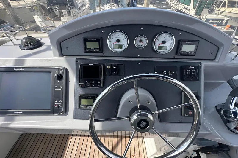 Slide: The Image of Helm of 2015 Beneteau Swift Trawler 44 with navigation instruments and steering wheel. - 17