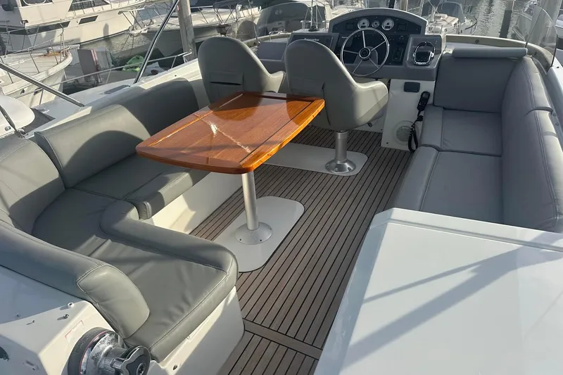 Slide: The Image of Flybridge of 2015 Beneteau Swift Trawler 44 with seating and helm station. - 21