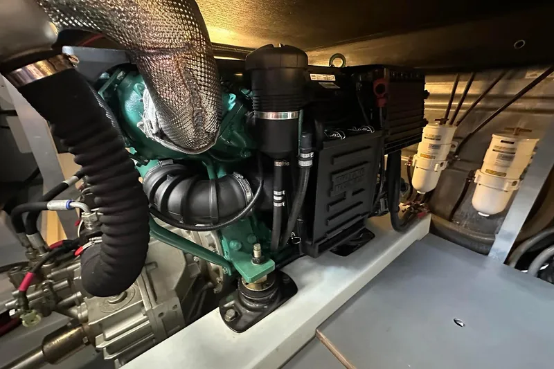 Slide: The Image of Engine room of 2015 Beneteau Swift Trawler 44, showcasing detailed mechanical components. - 41