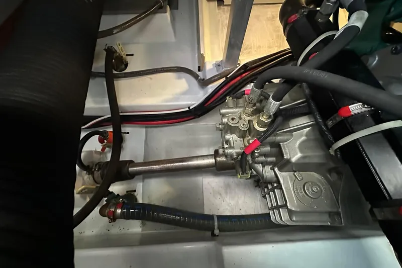 Slide: The Image of Engine compartment of a 2015 Beneteau Swift Trawler 44, showcasing mechanical components and wiring. - 44
