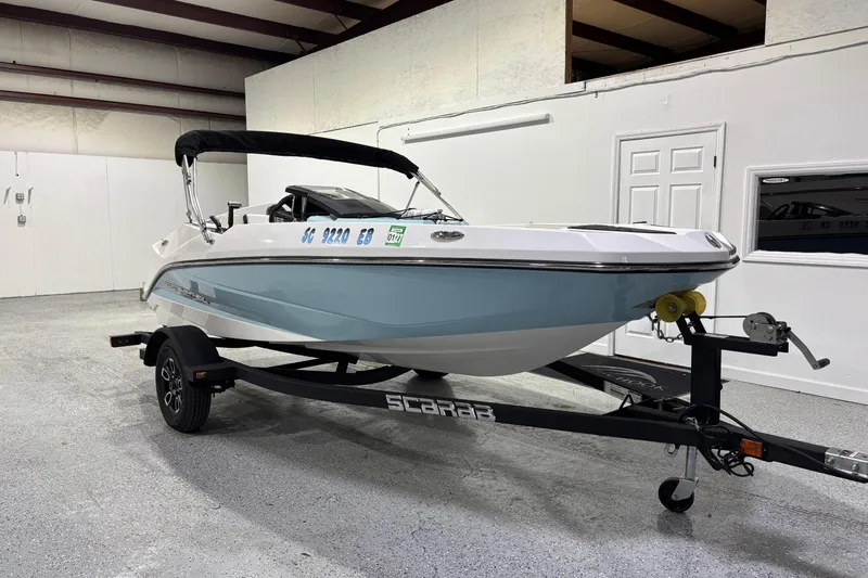 The Image of 2023 Scarab 165 ID boat on trailer in indoor storage facility. - 0