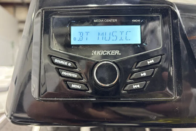 Slide: The Image of Kicker media center displaying "BT Music" in a 2023 Scarab 165 ID. - 10