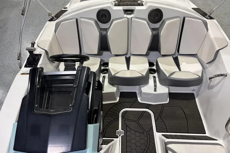 Slide: The Image of 2023 Scarab 165 ID boat interior with modern seating and sleek dashboard design. - 6