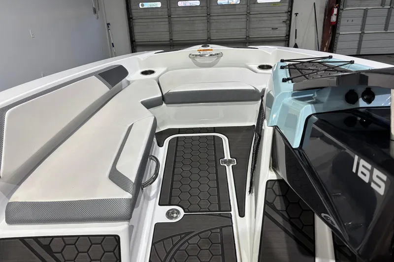Slide: The Image of 2023 Scarab 165 ID boat interior with seating and modern design. - 7