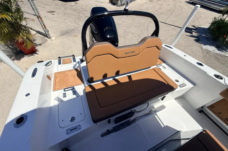 Slide: The Image of 2026 Sea Pro 245FLXR Sandbar boat interior with tan seating and sleek design. - 15