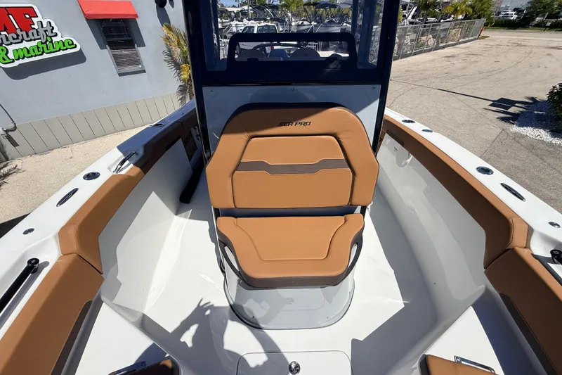 Slide: The Image of 2026 Sea Pro 245FLXR Sandbar boat interior with tan seating and sleek design. - 20