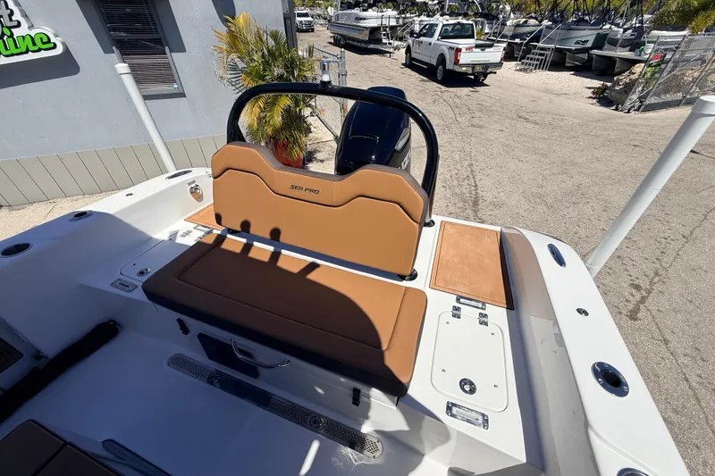 Slide: The Image of 2026 Sea Pro 245FLXR Sandbar boat interior with tan seating and modern design. - 23