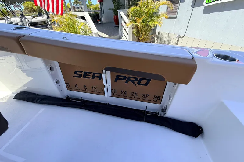 Slide: The Image of 2026 Sea Pro 245FLXR Sandbar boat interior with measuring board and seating. - 25