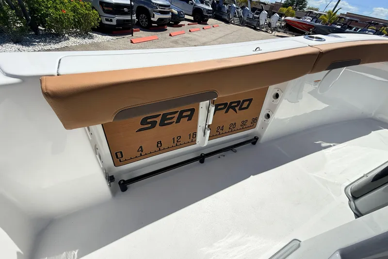 Slide: The Image of 2026 Sea Pro 245FLXR Sandbar boat interior with branded measuring board. - 26