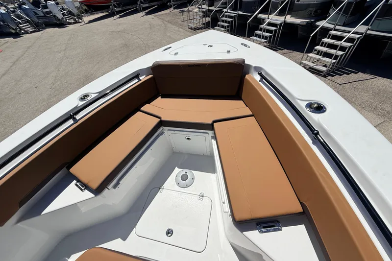 Slide: The Image of 2026 Sea Pro 245FLXR Sandbar boat with tan seating and spacious deck. - 30