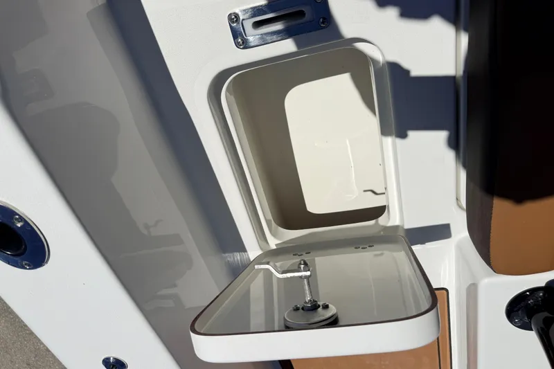 Slide: The Image of Open storage compartment on 2026 Sea Pro 245FLXR Sandbar boat. - 37