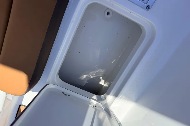 Slide: The Image of Interior compartment of 2026 Sea Pro 245FLXR Sandbar boat, featuring sleek design and storage space. - 38