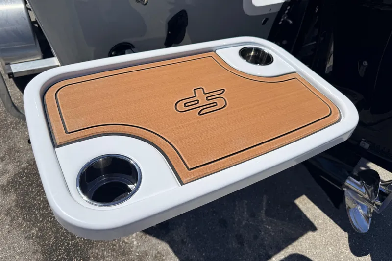 Slide: The Image of 2026 Sea Pro 245FLXR Sandbar boat table with cup holders and wood finish. - 39