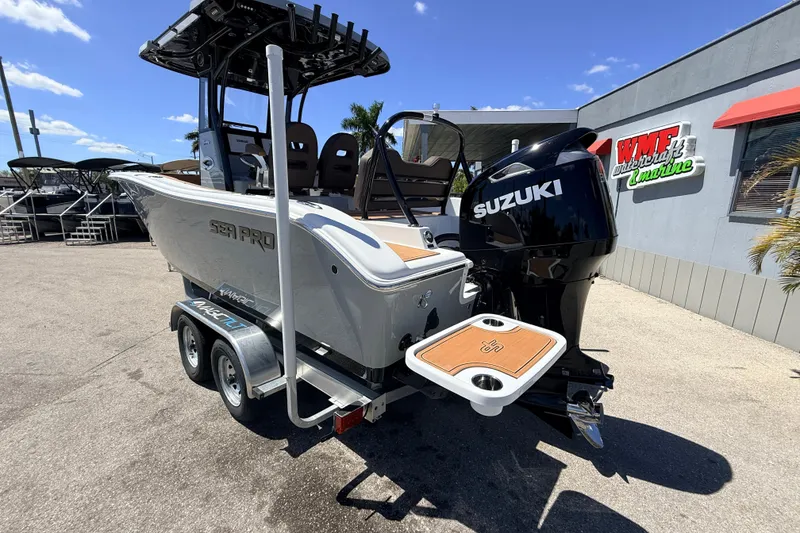 Slide: The Image of 2026 Sea Pro 245FLXR Sandbar boat with Suzuki engine on trailer. - 40