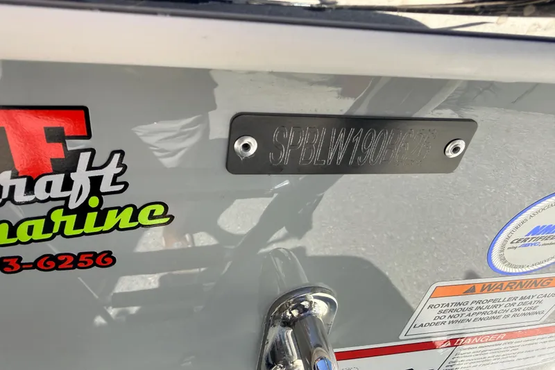 Slide: The Image of 2026 Sea Pro 245FLXR Sandbar boat with identification plate and warning labels. - 42