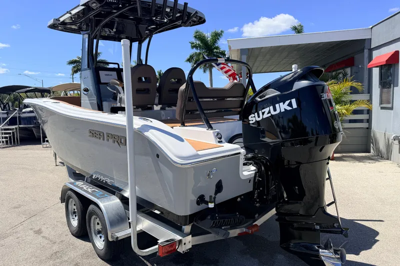 Slide: The Image of 2026 Sea Pro 245FLXR Sandbar boat with Suzuki engine on trailer. - 8