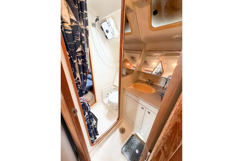 Slide: The Image of Interior of 2002 Hunter 380 sailboat bathroom with shower and sink. - 20