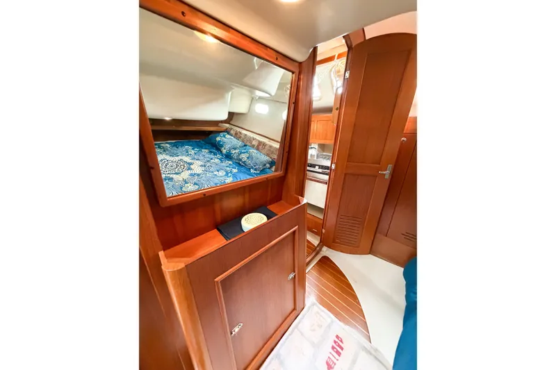 Slide: The Image of Interior of 2002 Hunter 380 sailboat with cozy cabin and wooden furnishings. - 42