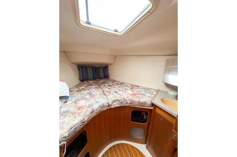 Slide: The Image of Cozy cabin interior of 2002 Hunter 380 sailboat with bed and sink. - 45