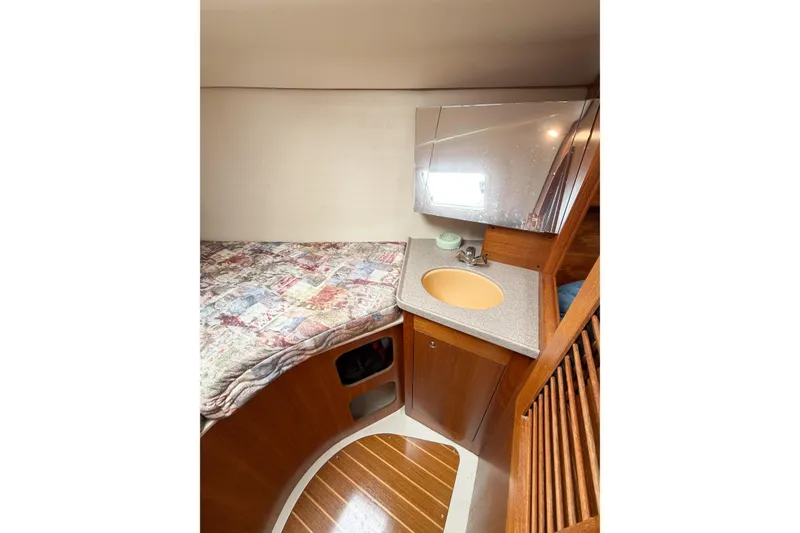 Slide: The Image of Cozy cabin interior of 2002 Hunter 380 sailboat with bed and sink. - 46