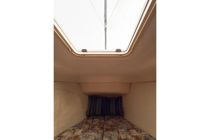 Slide: The Image of Cozy cabin interior of 2002 Hunter 380 sailboat with skylight and cushions. - 48