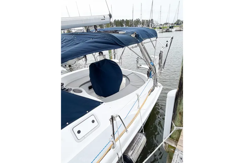 Slide: The Image of Sailboat docked with blue canopy, Hunter 380 model, 2002. - 5