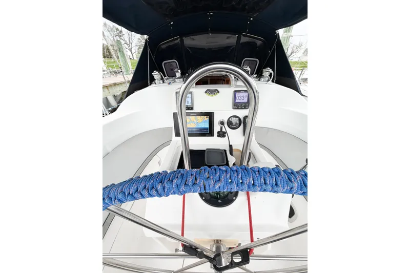 Slide: The Image of Cockpit of a 2002 Hunter 380 sailboat with navigation instruments and steering wheel. - 70