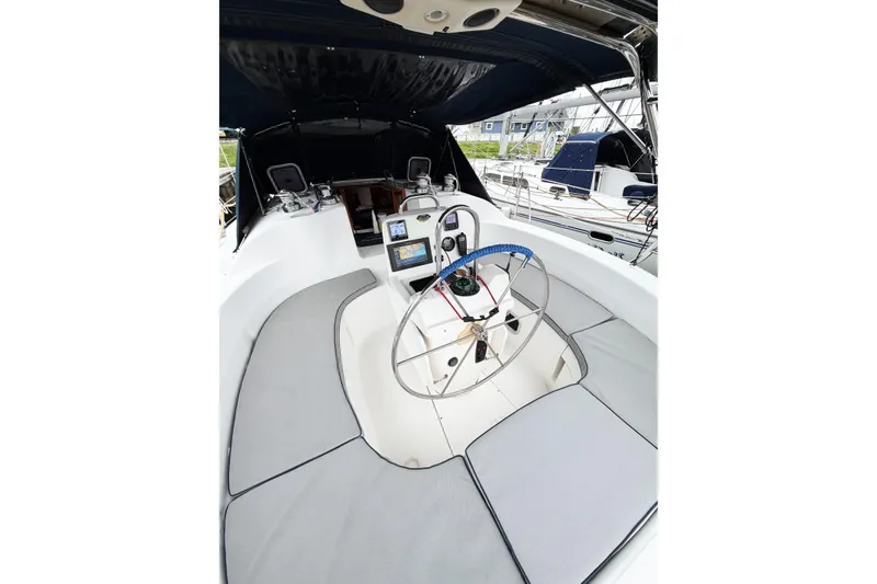 Slide: The Image of Cockpit of 2002 Hunter 380 sailboat with steering wheel and navigation equipment. - 71
