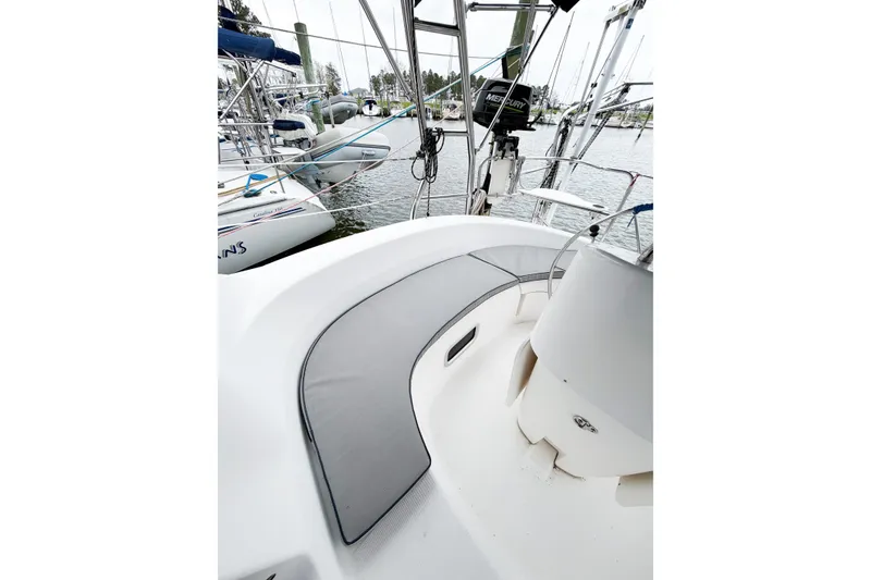 Slide: The Image of Cockpit view of a 2002 Hunter 380 sailboat docked at a marina. - 73