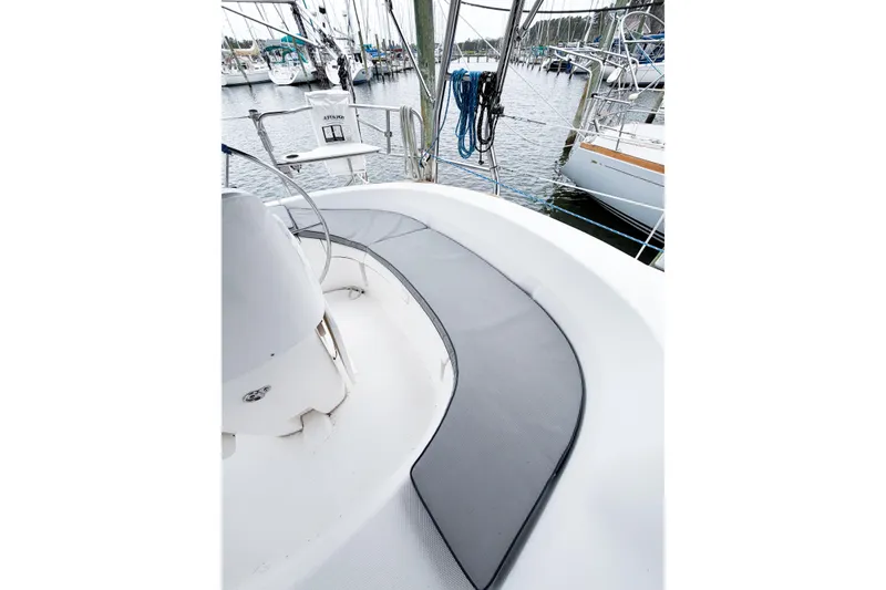 Slide: The Image of Cockpit view of a 2002 Hunter 380 sailboat docked at a marina. - 74