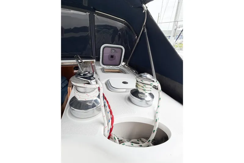 Slide: The Image of Deck of 2002 Hunter 380 sailboat with winches and ropes. - 75