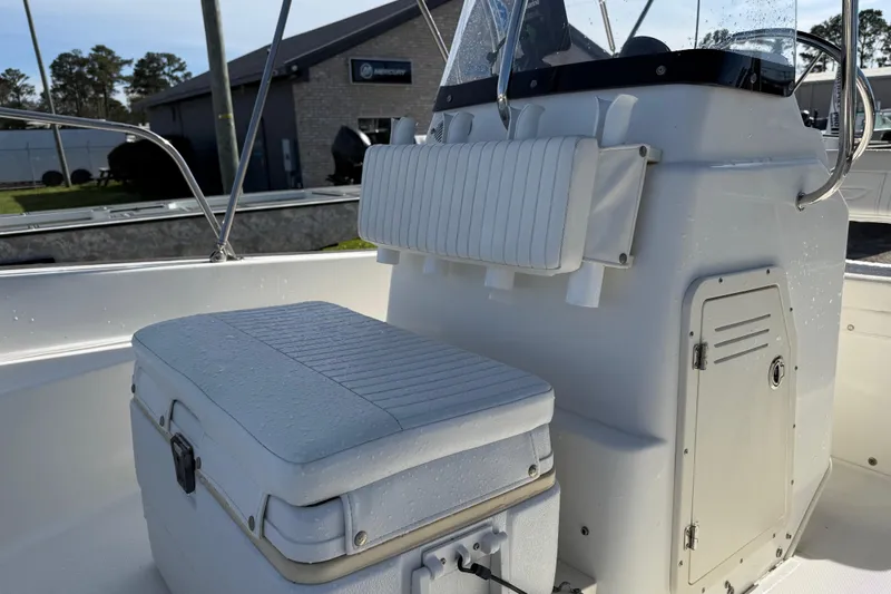 Slide: The Image of 2015 Boston Whaler 170 Montauk interior with seating and storage, showcasing marine craftsmanship. - 14