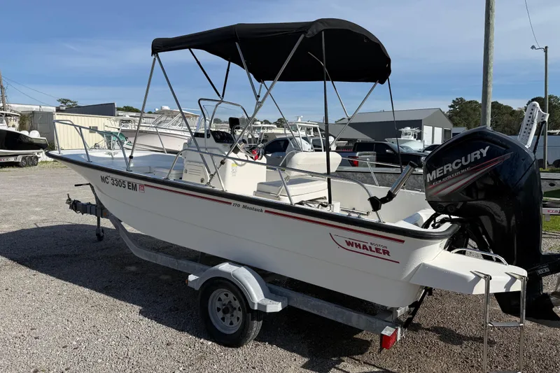 Slide: The Image of 2015 Boston Whaler 170 Montauk boat with Mercury engine on trailer. - 3