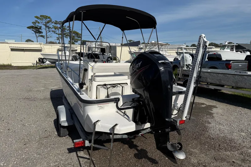 Slide: The Image of 2015 Boston Whaler 170 Montauk boat with Mercury outboard motor on trailer. - 5
