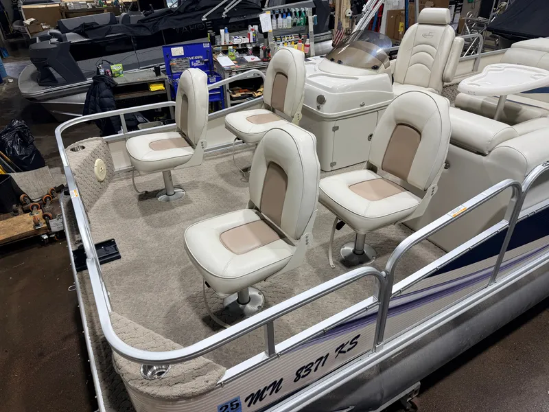 Slide: The Image of 2010 Misty Harbor pontoon boat with four seats, interior view. - 11