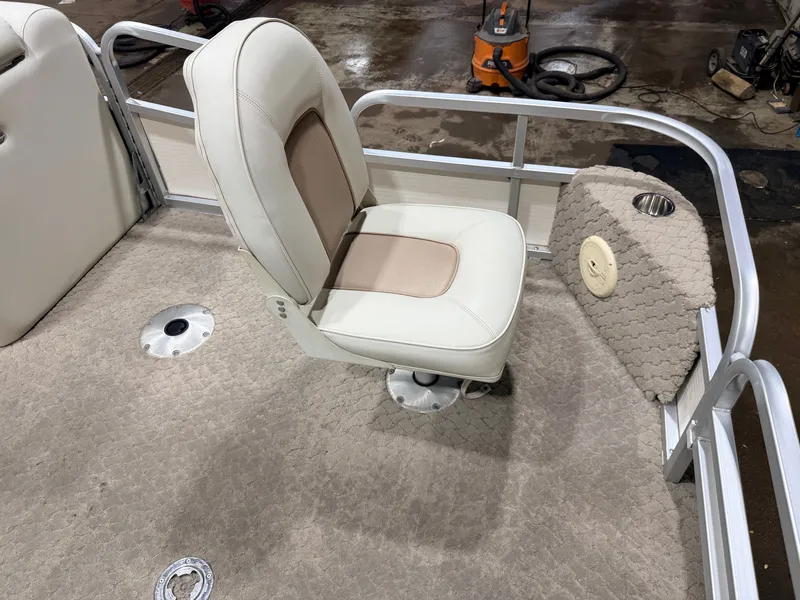 Slide: The Image of Interior of a 2010 Misty Harbor pontoon boat with seat and carpet. - 13