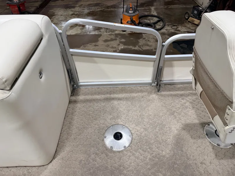 Slide: The Image of Interior of a 2010 Misty Harbor pontoon boat with carpeted floor. - 16