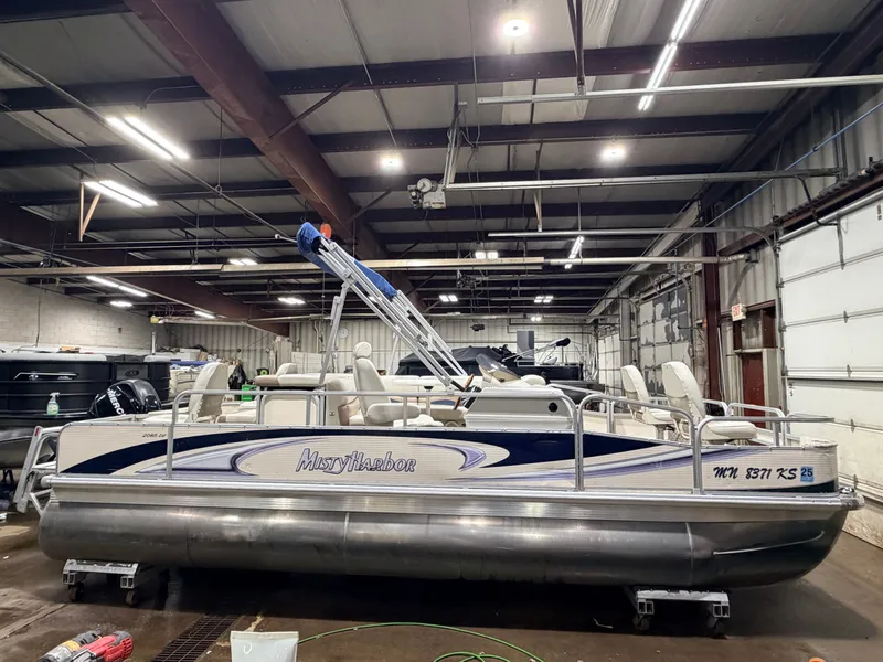 Slide: The Image of 2010 Misty Harbor pontoon boat in warehouse, model 2085DF with 50HP Mercury4Stroke. - 22