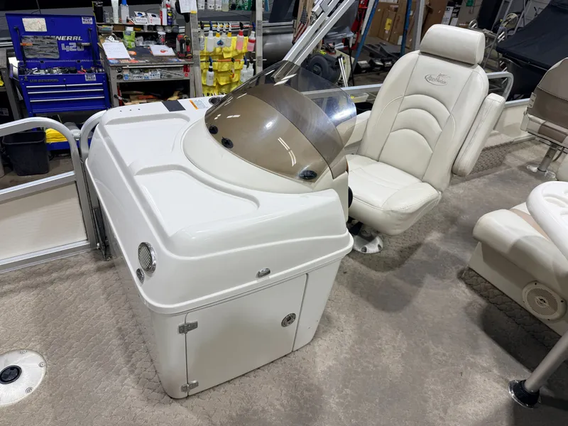 Slide: The Image of Interior of a 2010 Misty Harbor pontoon boat with helm console. - 23